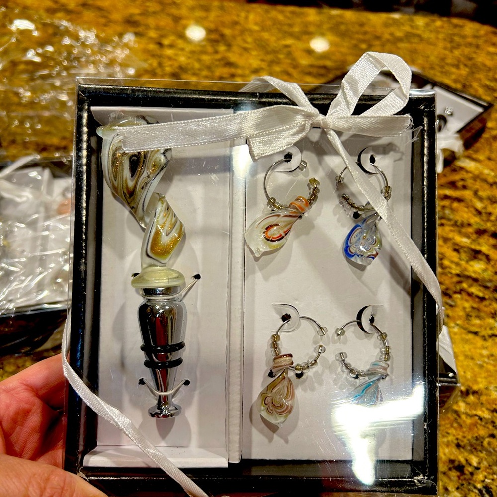 Wine bottle stopper and 4 glass charms.